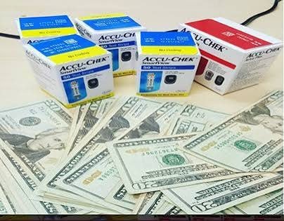 Sealed Accu-Chek SmartView test strip boxes beside cash