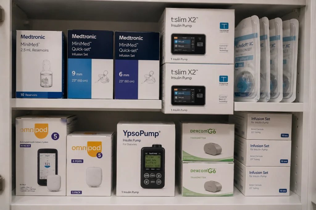 Shelves of sealed insulin pump supplies: Medtronic MiniMed, Tandem t:slim X2, Omnipod and Dexcom G6