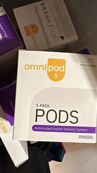 A sealed Omnipod 5 five-pack of pods, automated insulin delivery system
